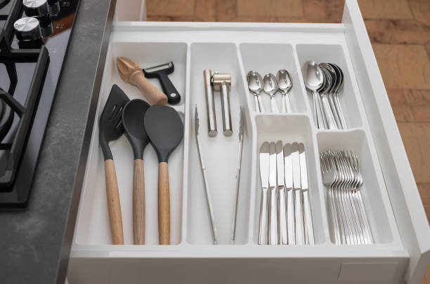 istock Inside of kitchen opened drawer with utensils and cutlery 1353210515