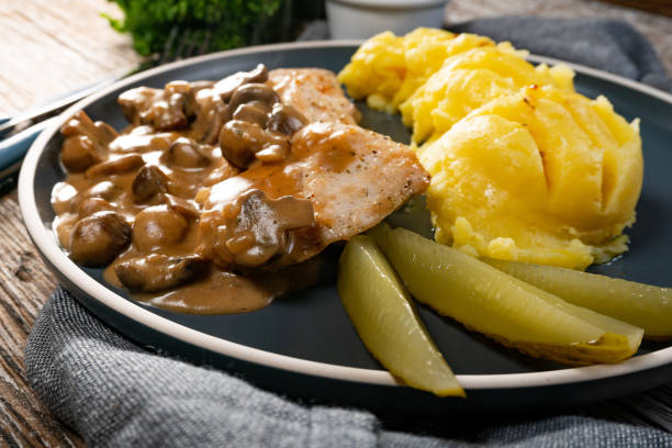 istock Grilled chicken breast with mushroom sauce. 1353210672