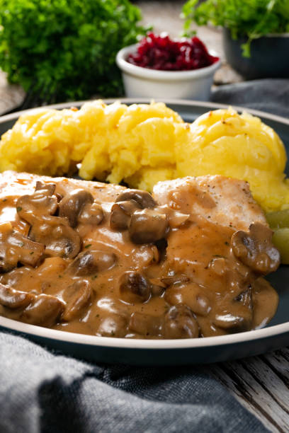 istock Grilled chicken breast with mushroom sauce. 1353210711