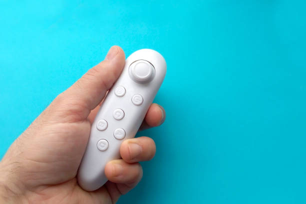 istock Wireless gamepad on a blue background new gaming reality technology 1353210778