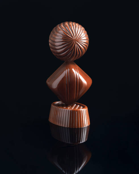 istock Dark bitter chocolate candies in a box. 1353213946