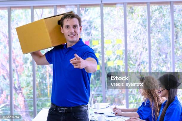 Delivery Man Service Stock Photo - Download Image Now - Delivery Person, Pointing, 25-29 Years