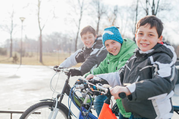 istock Boys Riding Bikes In The Skate Park 1353216650