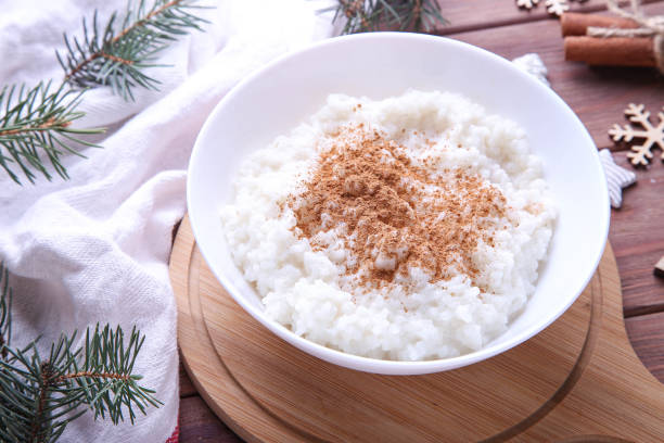 istock Christmas rice pudding with cinnamon on a wooden background 1353218692