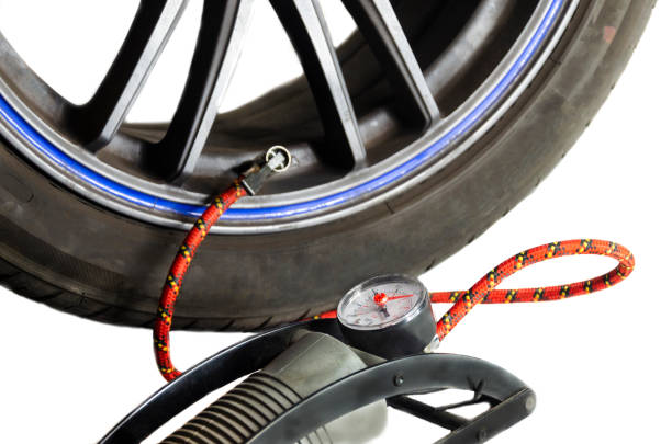 istock Car tyre foot pump isolated on white 1353219992