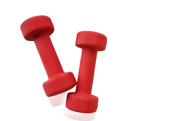 istock Two dumbbells with diamonds on the ends of red on a white background. Two projectiles for physical exercises 1353222180