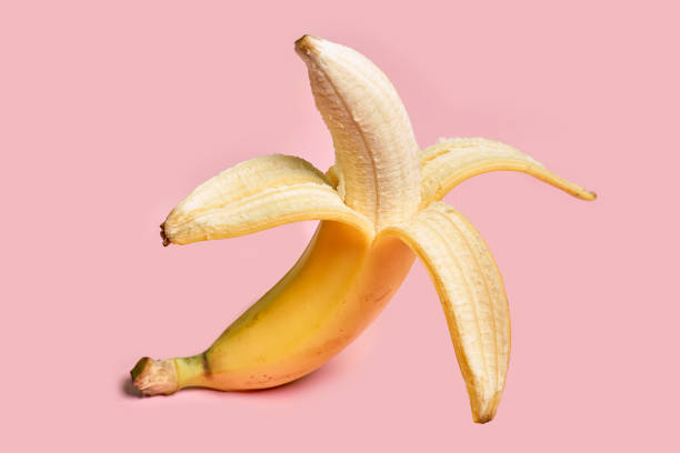 istock Half peeled ripe banana 1353222514