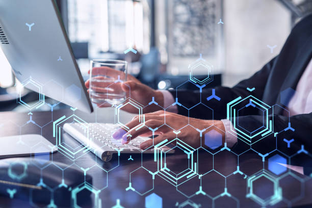 istock Hands typing the keyboard to create innovative software to change the world and provide a completely new service. Close up shot. Hologram tech graphs. Concept of Dev team. Formal wear. 1353223257