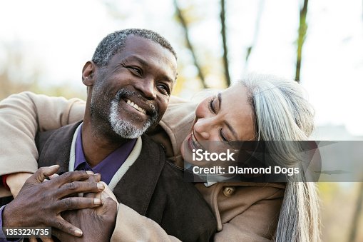 istock Storytelling image of a multiethnic senior couple in love 1353224735