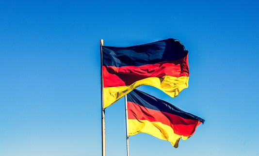 Two German national flags in the wind.