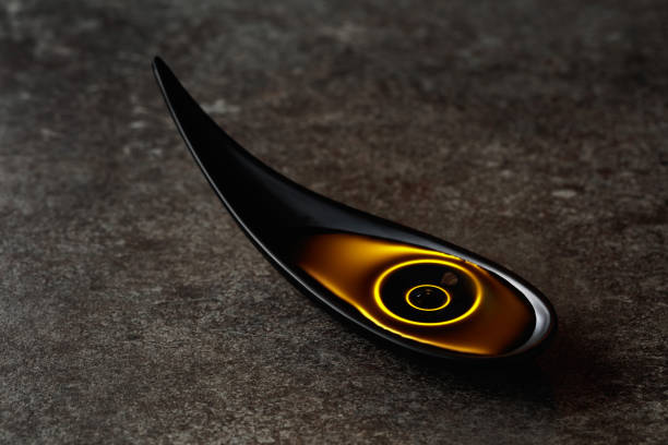 istock Vegetable oil in small bowl on a stone table. 1353226324