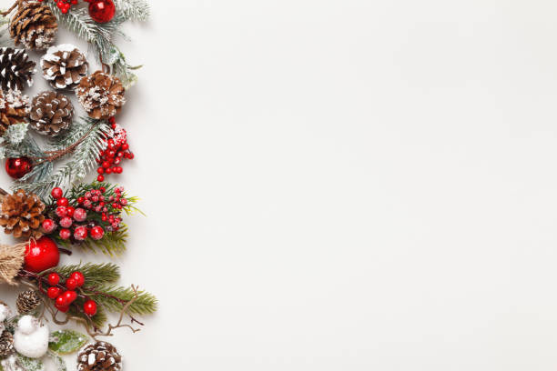 istock Christmas winter concepts. Fir branches with cones on a gray background. Borders flat lay top view copy space 1353228305