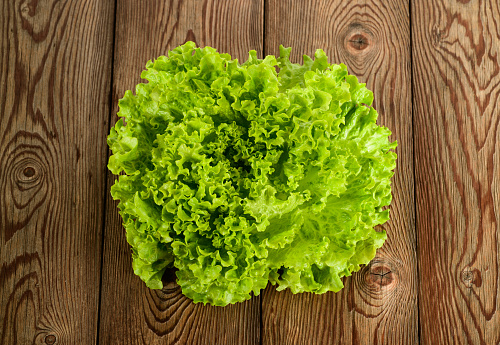 Lettuce bunch on a wood background
