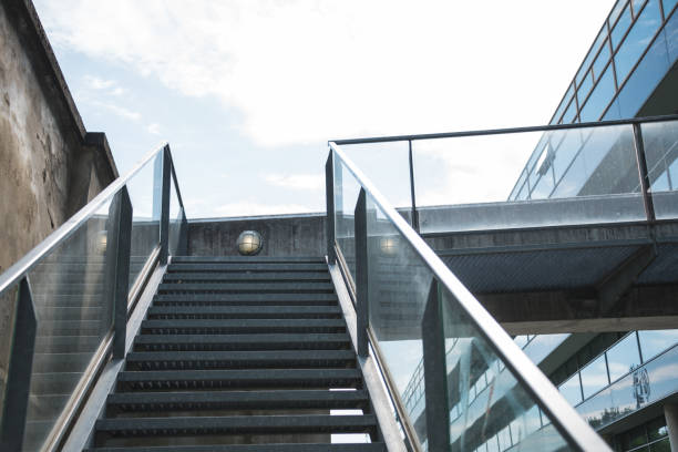istock Metal staircase leading towards sky 1353231561