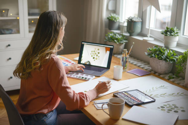 istock woman artist at work (with laptop) 1353231831