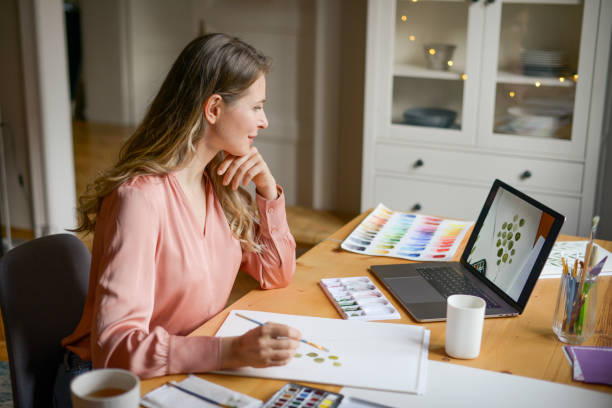 istock woman artist at work (with laptop) 1353232421