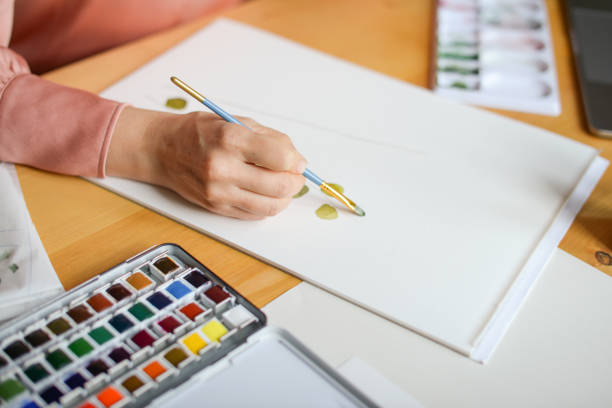 istock woman artist at work 1353232522