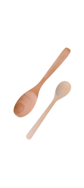 istock Two wooden spoons of different sizes isolated on white background. 1353232556