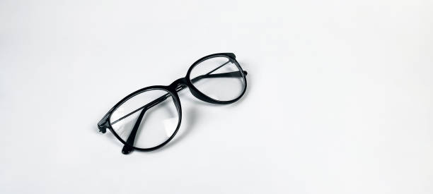 istock Folded eyeglasses with black frames isolated on a white background. 1353232633