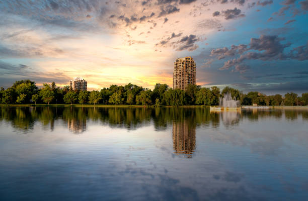Apartment reflection in a pond with a nice sky