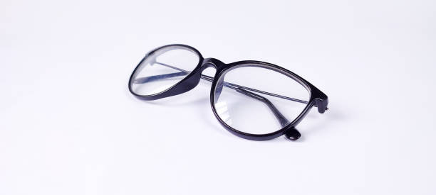 istock Folded eyeglasses with black frames isolated on a white background. 1353233694