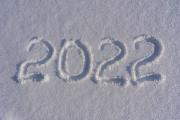 istock Happy new year 2022 sign text written with numbers from snow on snow surface 1353235148