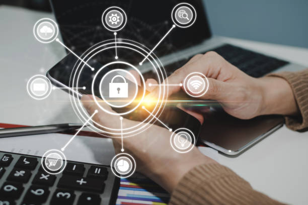 istock customer hand using digital mobile phone with virtual graphic icon, laptop computer and report on desk at home office, digital marketing, work from home, business finance, network technology concept 1353236329