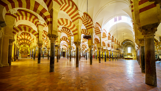 Panoramic view of the Cordoba Mosque in its interior illuminated by natural light.