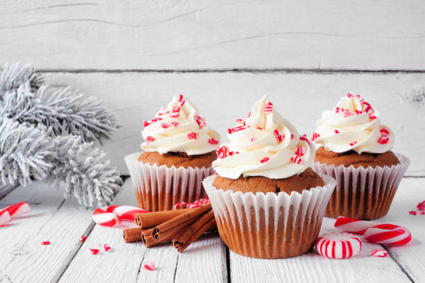 istock Christmas peppermint cupcakes against rustic white wood 1353246047