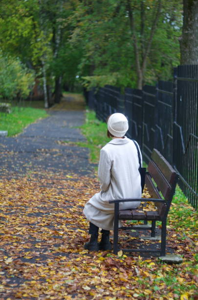 istock A girl in an autumn park. 1353246089
