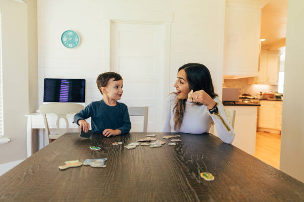 istock Young Boy Playing with his Mom at Home 1353246851