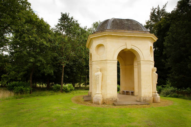 Temple of the Sybil in Buttes Chaumont Park seen from bellow with no people, taken on a early summer sunny afternoon in Paris, France