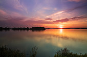 Lake Musov - South Moravia - Czech Republic. Calm water at sunset. Beautiful clouds in the sky