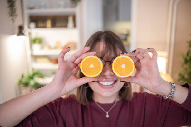 istock Woman preparing fresh fruit juice 1353250774