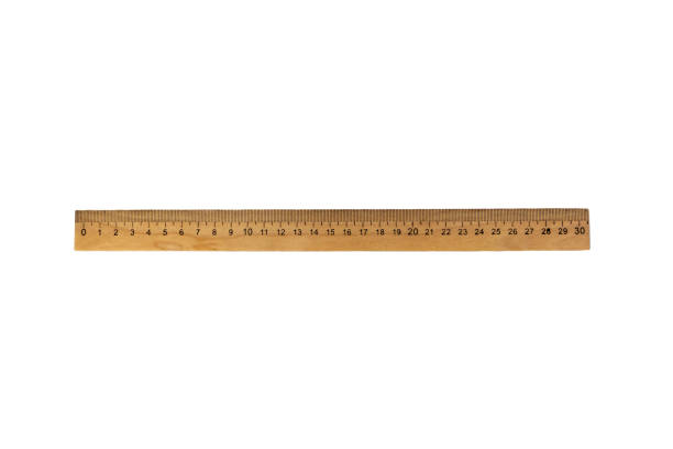 istock Wooden ruler close-up. Isolated object on a white background 1353253507