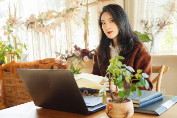 istock Young businesswomen learn to read while working 1353254277