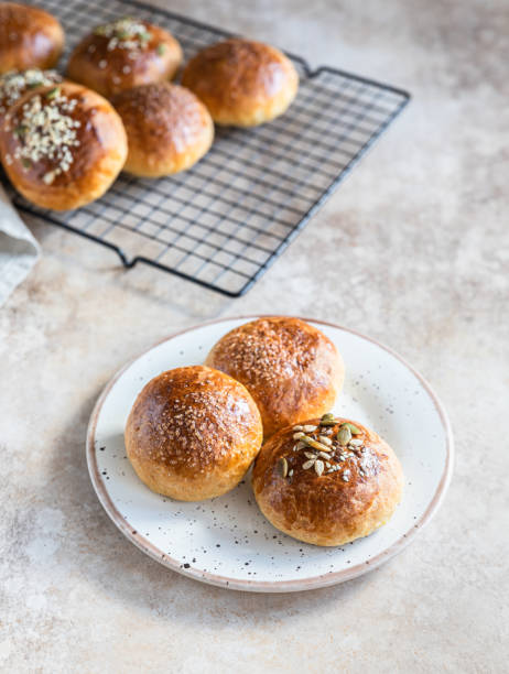 istock Sweet pumpkin buns with cinnamon and anise, light concrete background. 1353257168