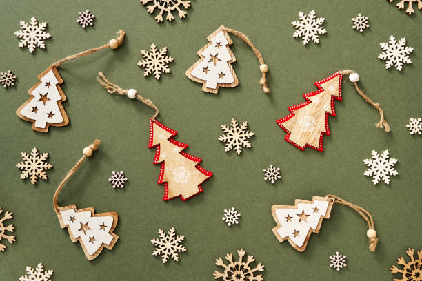 istock Green Christmas background with wooden ornaments 1353257885