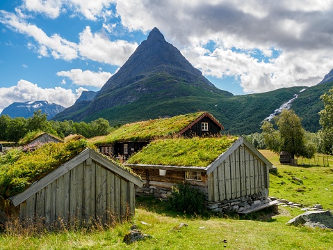 Typical norwegian old wooden houses with grass roofs in Innerdalen - Norway's most beautiful mountain valley, near Innerdalsvatna lake. Norway, Europe.