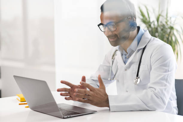 istock Male MD communicating with a patient via video 1353258877