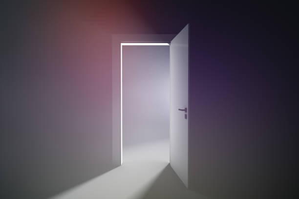 istock Open door to a room with bright light 1353259597