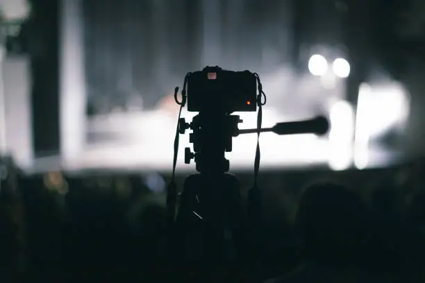 Photo of camera recording theater performance