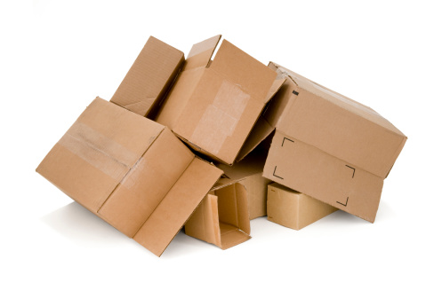 Pile of cardboard boxes ready to be recycled. Image is isolated on a white background.