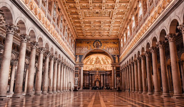 the papal basilica of saint paul outside the walls in rome, italy. - flavian amphitheater coliseum rome imagens e fotografias de stock