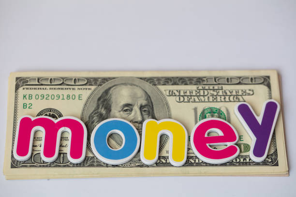 money colorful inscription on US 100 dollar banknote