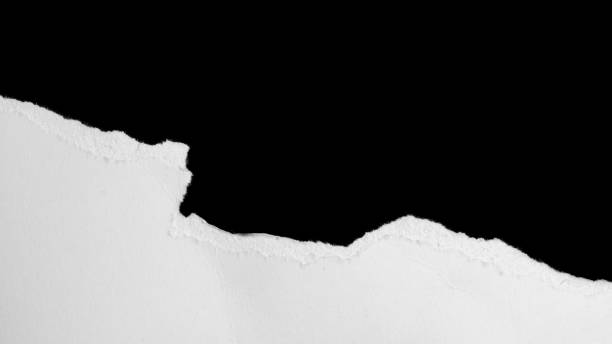 istock a white piece of paper on a black isolated background 1353267344