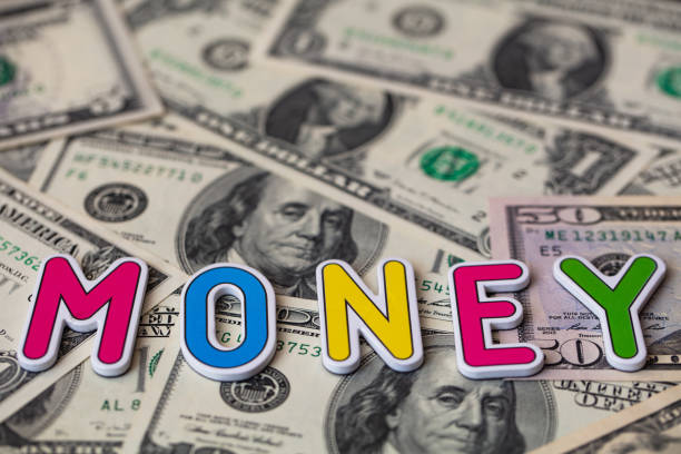 istock money colorful inscription on US dollar 1353268507