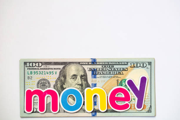 money colorful inscription on US 100 dollar banknote