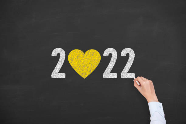 istock New Year 2022 with Heart Shape on Chalkboard Background 1353268979