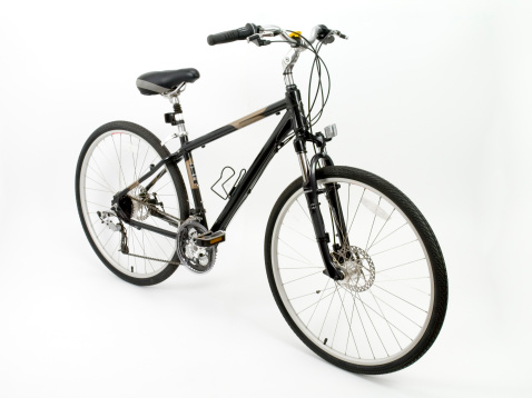 Oslo, Norway - June 17 2023: Punctured bicycle locked to a bike rack.
